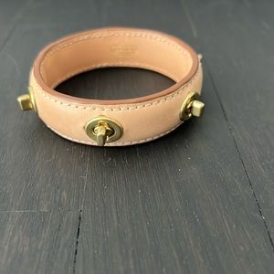 Coach tan leather turn lock bangle bracelet